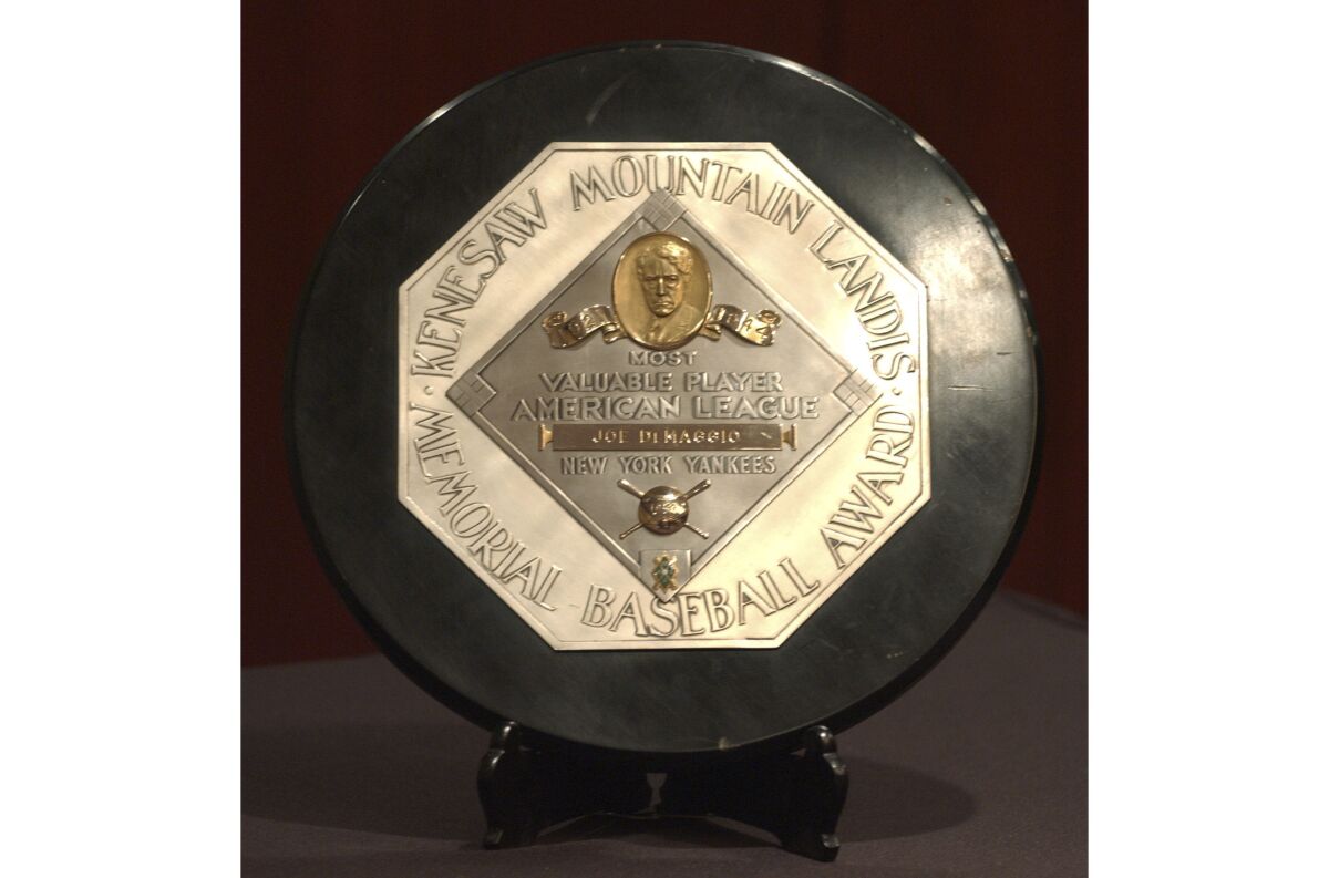 FILE - In this Jan. 22, 2006, file photo,a Joe DiMaggio 1947 MVP Award Plaque is displayed at a news conference in New York. The plaque features the name and image of Kenesaw Mountain Landis. (AP Photo/Jennifer Szymaszek, File)