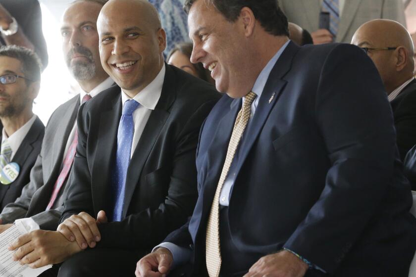 U.S. Sen. Cory Booker, left, and New Jersey Gov. Chris Christie are among the politicians whose style is critiqued by Tim Gunn for Politico.