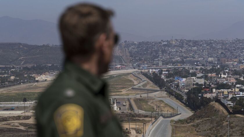 Rodney Scott, chief of the Border Patrol's San Diego sector, looks out towards Tijuana, in April.