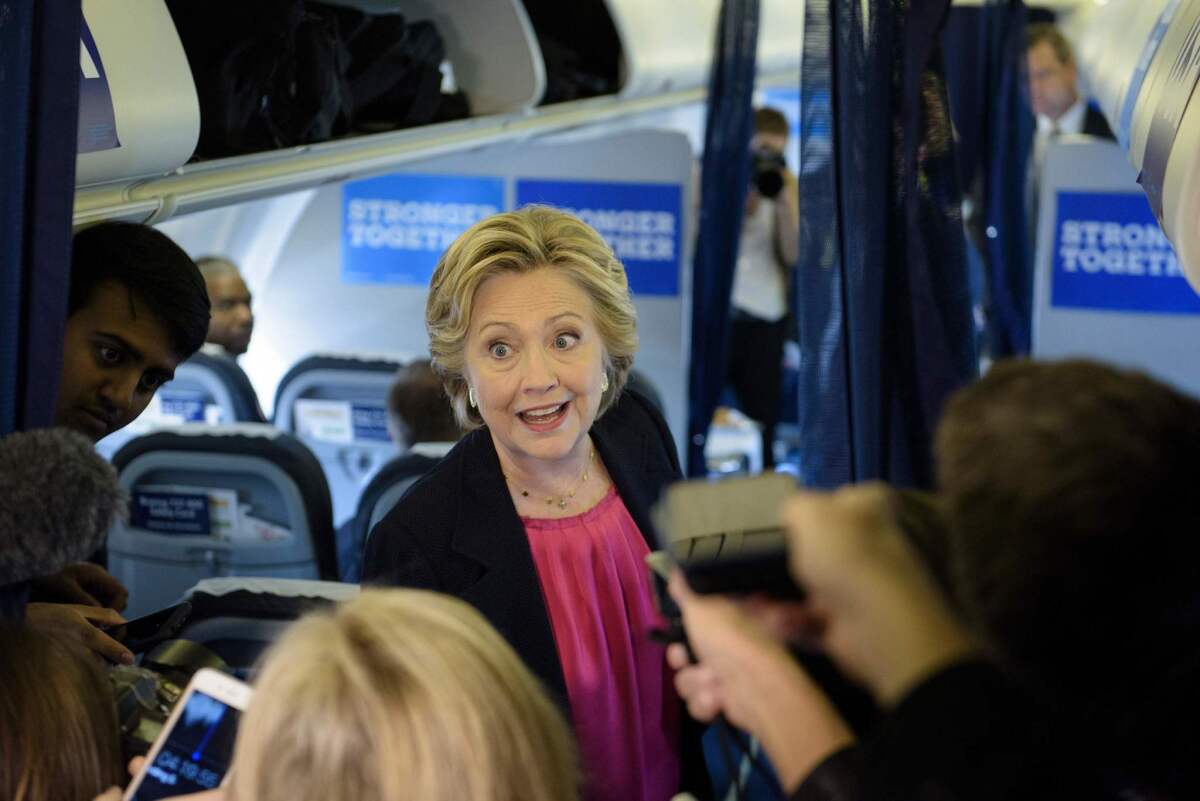 Hillary Clinton speaks to reporters on her plane on Tuesday.