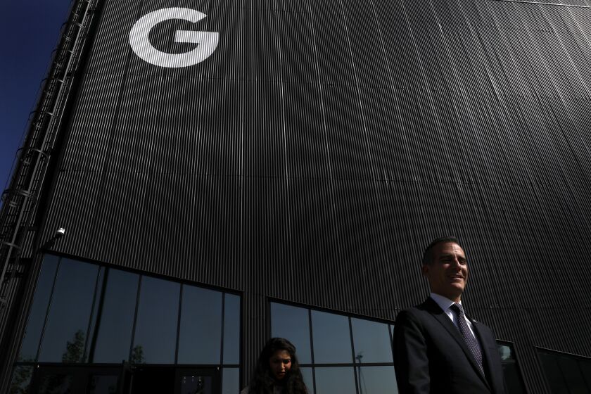 PLAYA VISTA-CA-NOVEMBER 8, 2018: Mayor Eric Garcetti, right, leaves Google's new office at the Spruce Goose hangar in Playa Vista after a tour during its grand opening on Thursday, November 8, 2018. (Christina House / Los Angeles Times)