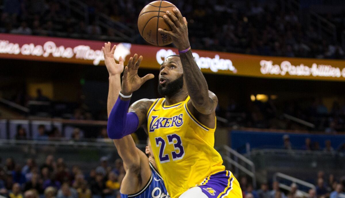 LeBron James scores 22 points against Aaron Gordon and the Magic, but the Lakers' four-game win streak is snapped.