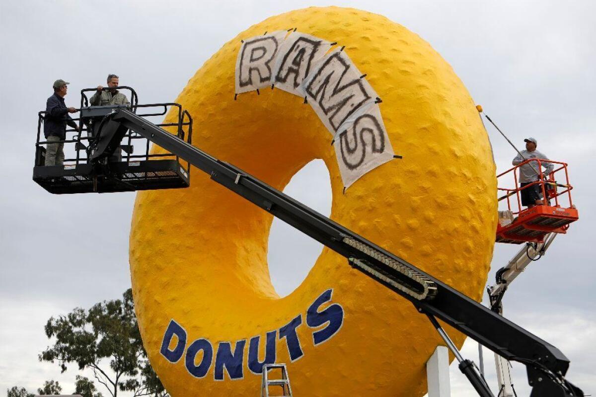 The Randy’s Donuts sign gets a Rams-themed makeover in Inglewood.