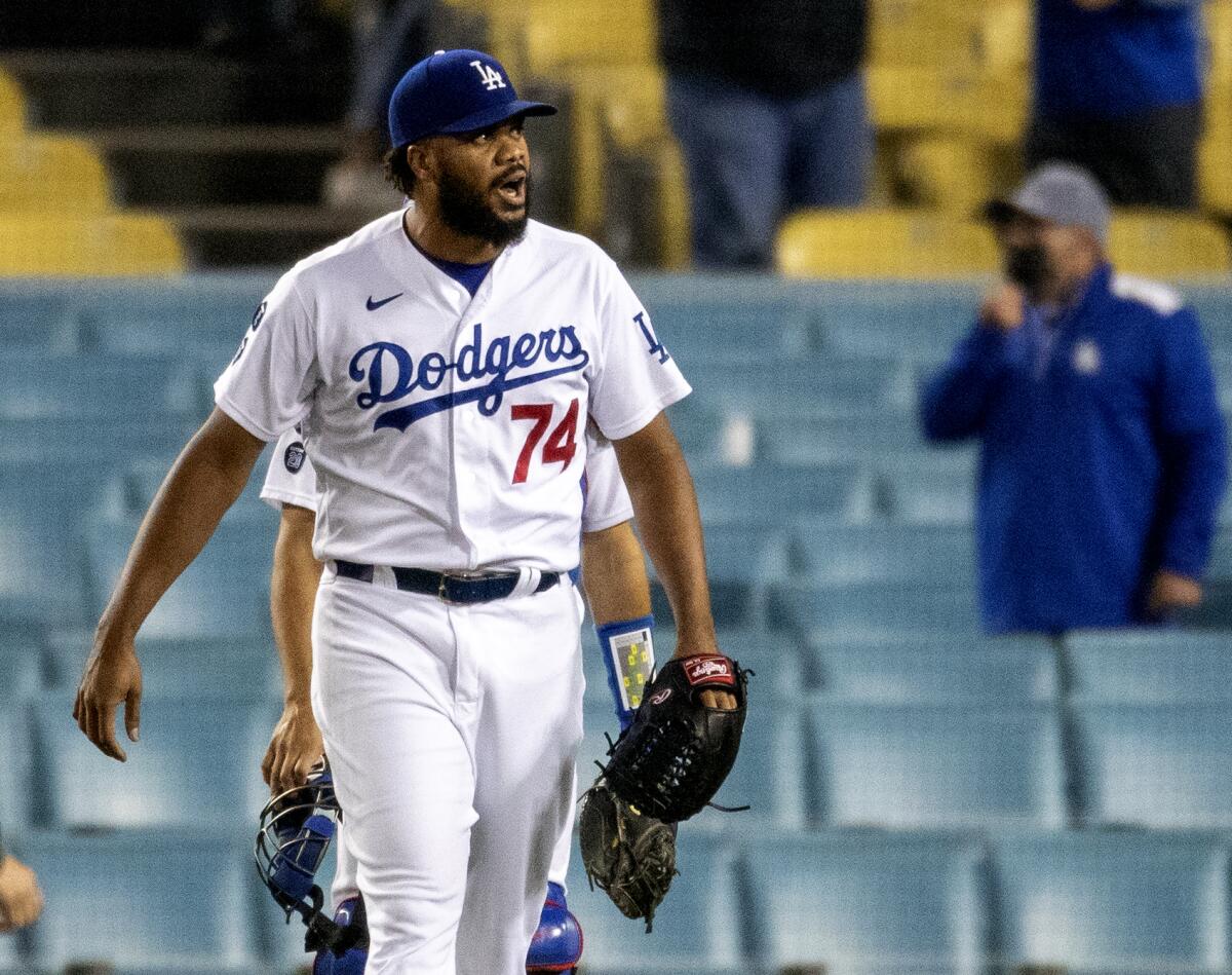 Kenley Jansen reacts after getting the save Wednesday night against the Colorado Roc.