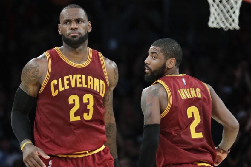 Cleveland Cavaliers' LeBron James, left, and Kyrie Irving play the Los Angeles Lakers in 2016.