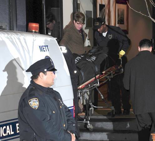 Philip Seymour Hoffman's body is transported to a New York Medical Examiner's van.