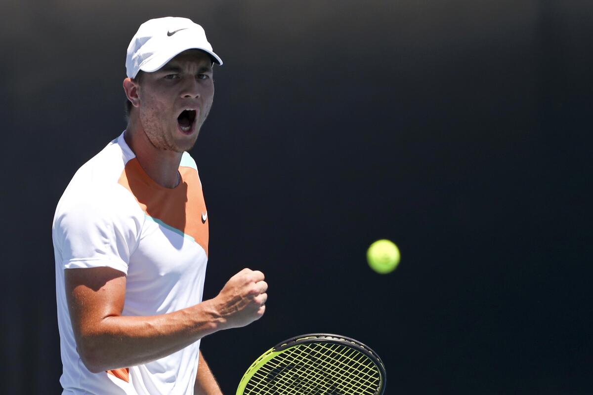 Miomir Kecmanovic of Serbia reacts during his third round match against Lorenzo Sonego of Italy at the Australian Open tennis championships in Melbourne, Australia, Friday, Jan. 21, 2022. (AP Photo/Tertius Pickard)