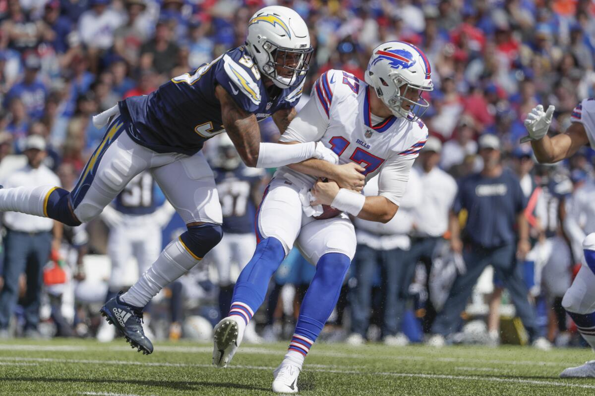 Chargers safety Derwin James sacks Buffalo Bills quarterback Josh Allen during first half at New Era Field on Sunday.