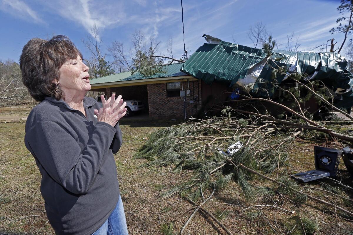 Peggy Taylor said she prayed as she, a friend and her 10-month-old grandson huddled in a tub while what she believes was a tornado destroyed her patio in the Stronghope community near Wesson, Miss.