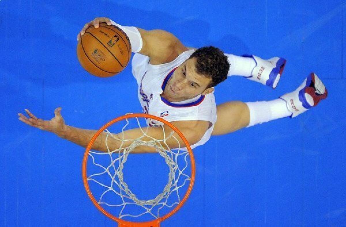 Clippers power forward Blake Griffin elevates for a shot against the Magic on Saturday afternoon at Staples Center.