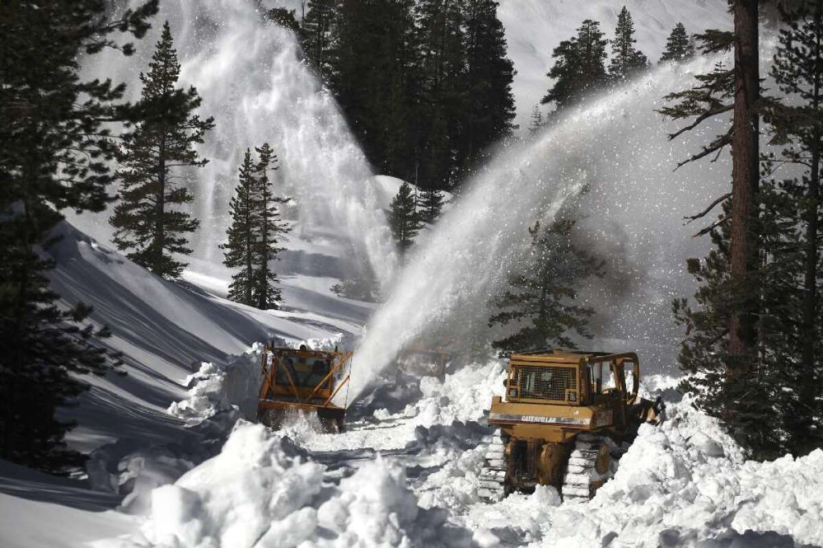 Road crews work to clear roads in Yosemite National Park during heavy snow in 2011.