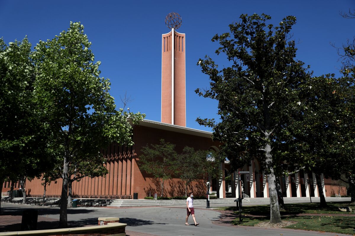  A prominent USC building displays a tower with a globe on top.