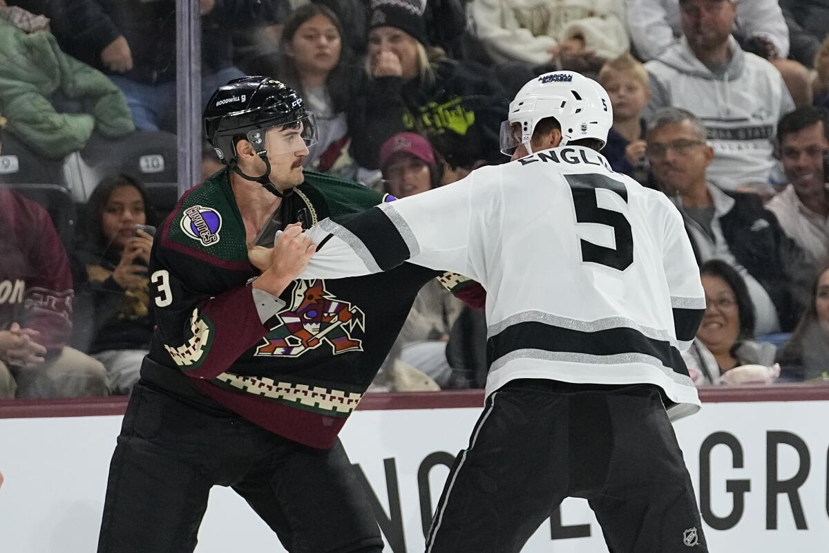 Kings defenseman Andreas Englund and Arizona Coyotes defenseman Josh Brown fight during a game Monday in Tempe, Ariz. 