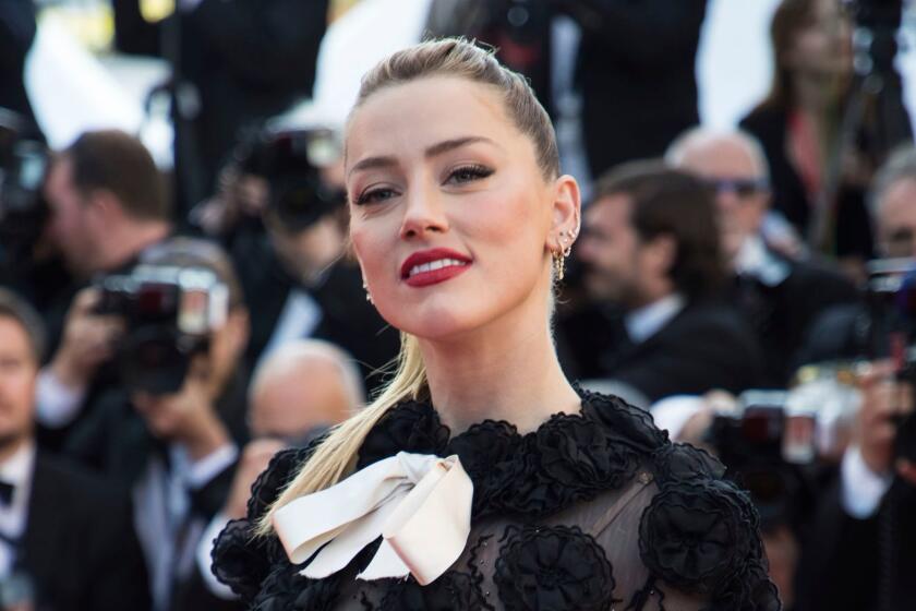 Mandatory Credit: Photo by Vianney Le Caer/Invision/AP/REX/Shutterstock (9669591ax) Actress Amber Heard poses for photographers upon arrival at the premiere of the film 'Girls of The Sun' at the 71st international film festival, Cannes, southern France 2018 50/50 2020, Cannes, France - 12 May 2018