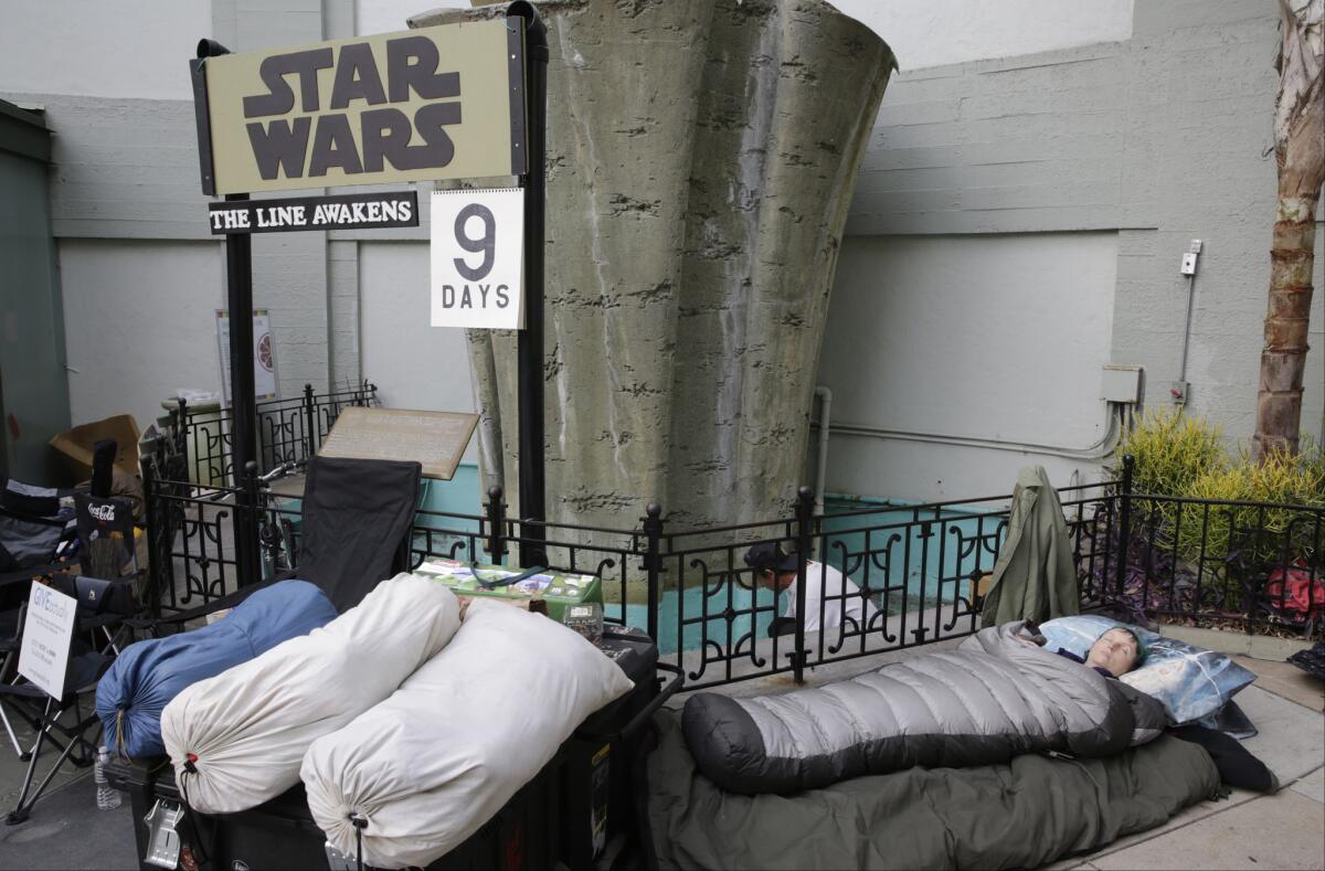 On Dec. 9, Caroline Ritter of Hunter Valley, Australia, sleeps while waiting to be first in line for a chance to see the latest episode in the "Star Wars" saga, "The Force Awakens," at the TCL Chinese Theatre in Los Angeles.