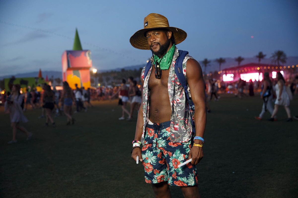 Andrew Gill, 34, of New York City - "My friends laughed at me for wearing florals," said Andrew Gill, 34, of New York City. "But now I can say it was photographed by the Los Angeles Times." as he poses for a portrait during weekend one of the three-day Coachella Valley Music and Arts Festival at the Empire Polo Grounds on Saturday, April 15, 2017 in Indio, Calif. (Patrick T. Fallon/ For The Los Angeles Times)
