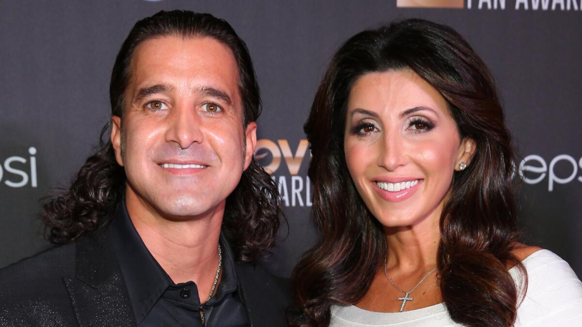 Scott Stapp, seen with wife Jaclyn Stapp in Nashville in June 2014, is now being treated for bipolar disorder after a serious manic episode late last year. He's also traded in his trademark long hair for a cleaner look.