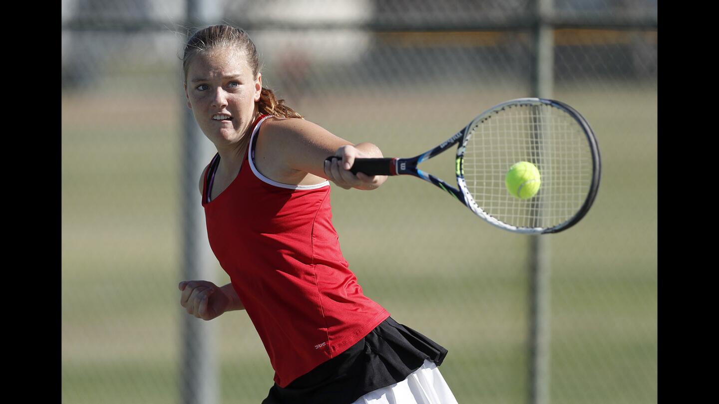 Estancia High's Annie Mitchell competes against Costa Mesa during a Battle for the Bell No.1 singles game in Costa Mesa on Thursday, Oct. 5.