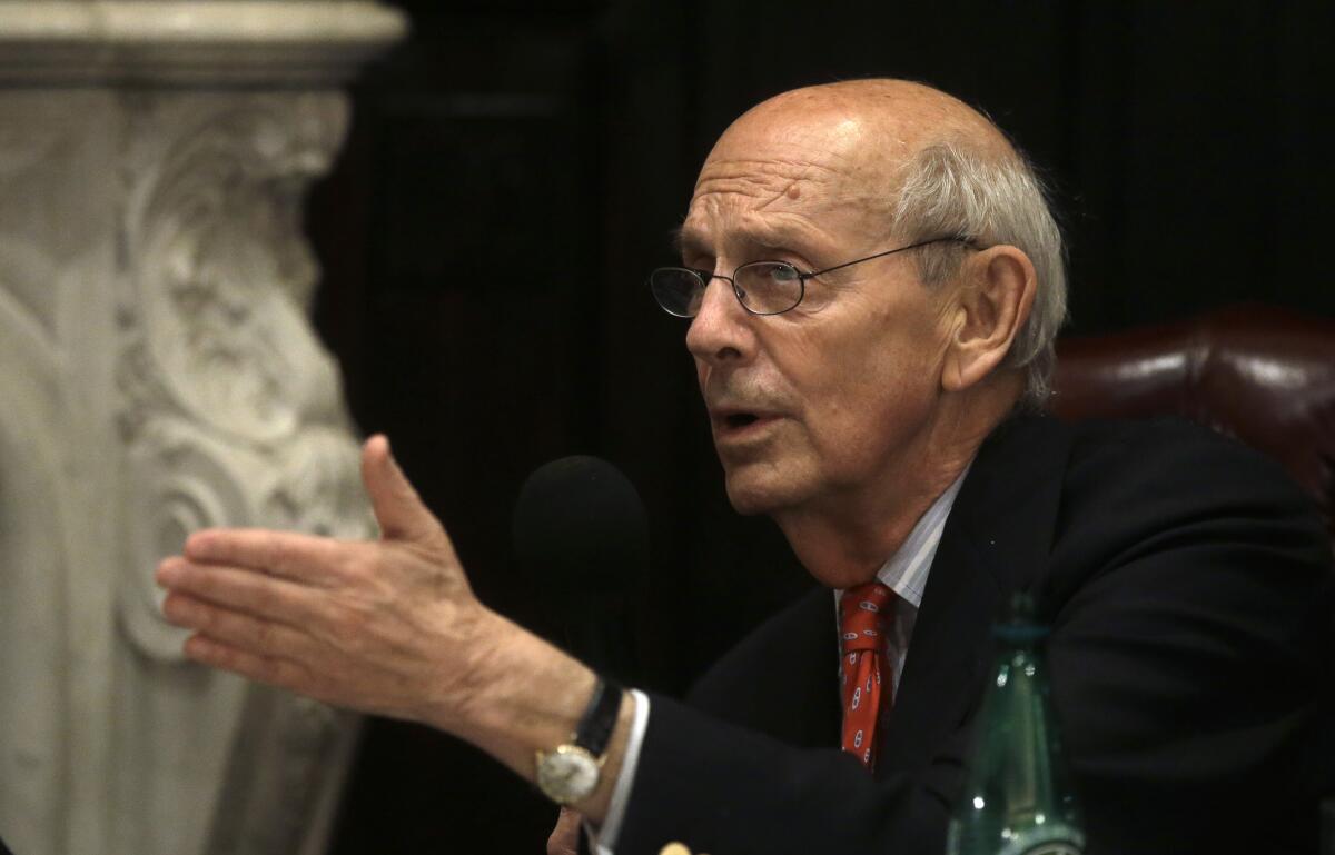 Supreme Court Justice Stephen G. Breyer gestures and speaks.