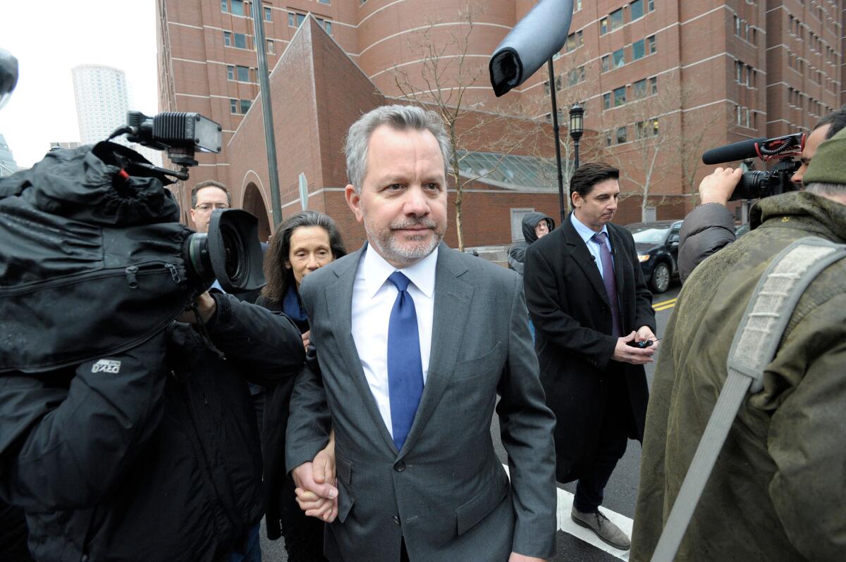 William McGlashan, Jr., former senior executive at TPG, makes his way out of the courthouse.