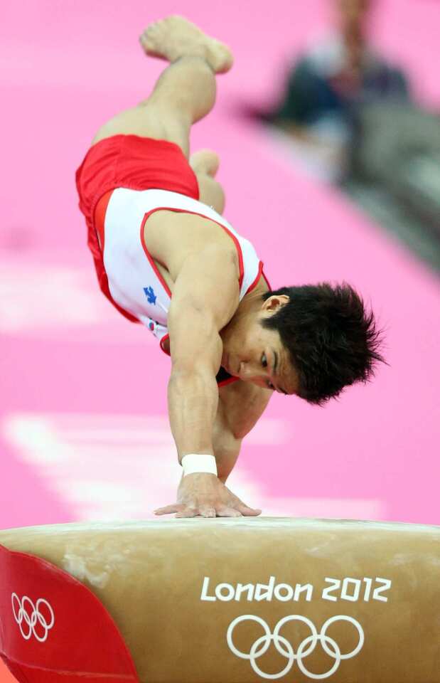 South Korean gymnast Yang Hak-seon performs on the vault during the artistic gymnastics apparatus finals.