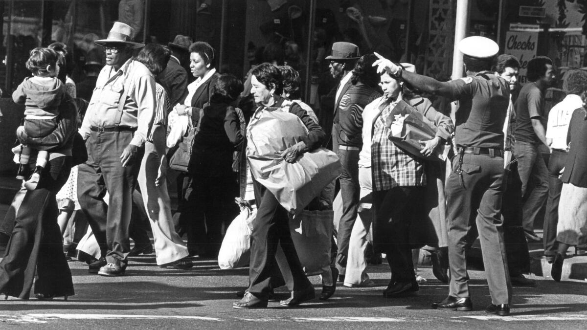 Shoppers fill a sidewalk in downtown Los Angeles in 1980. (Larry Davis / Los Angeles Times)