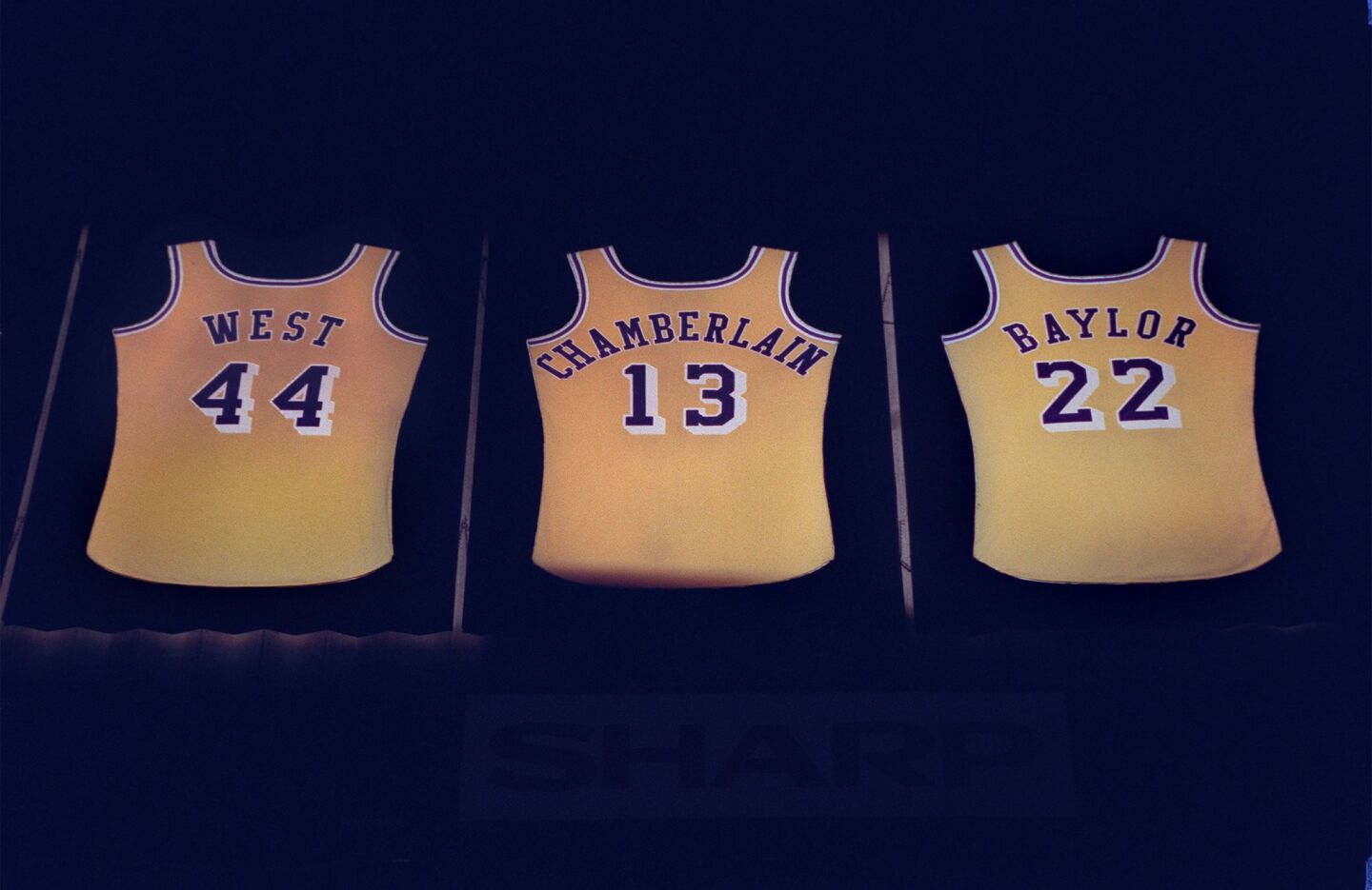 Three of the seven jerseys displayed above the seats of the Great Western Forum honor former Lakers Jerry West, Wilt Chamberlain and Elgin Baylor.