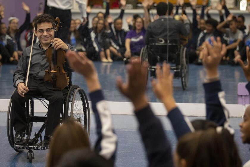 GRANADA HILLS, CALIF. - NOVEMBER 21: Niv Ashkenazi is a Northridge violinist who is talking to students at Patrick Henry Middle School in Granada Hills, CA Novem,ber 21, 2019. Niv is representing Violins of Hope, a program in which musicians play instruments that were played by Nazi concentration camp prisoners.Granada Hills, Calif. on Thursday, Nov. 21, 2019. (Francine Orr / Los Angeles Times)