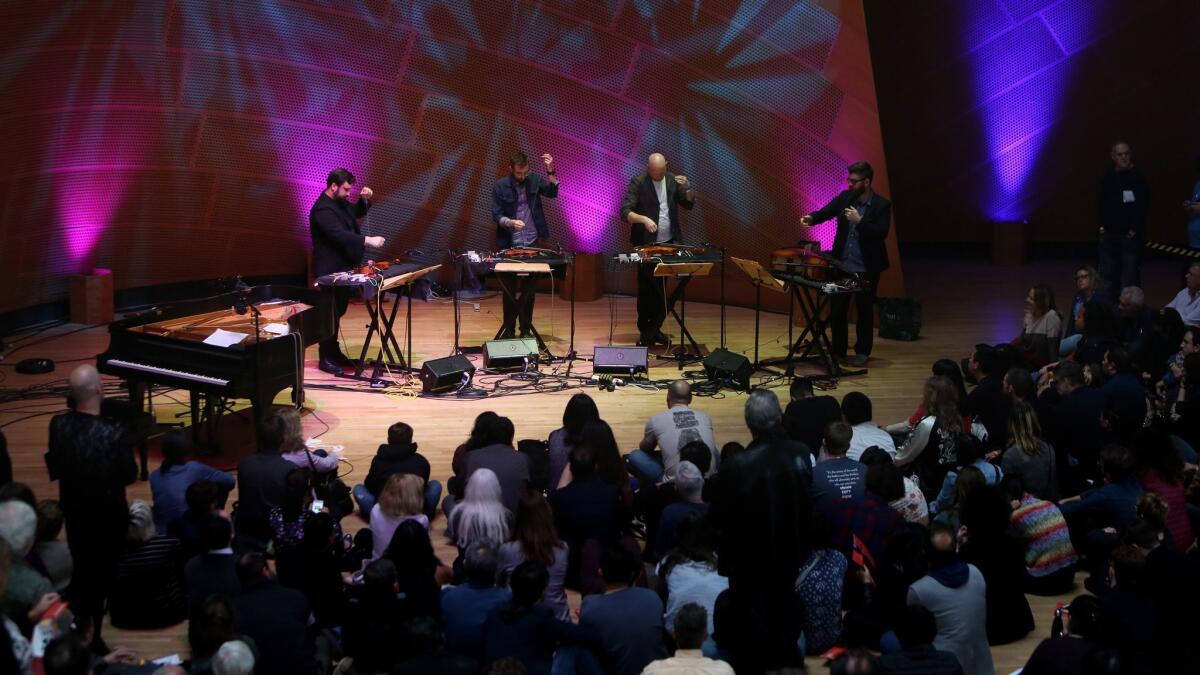 So Percussion members, from left, Adam Sliwinski, Eric Cha-Beach, Jason Treuting and Josh Quillen perform during the L.A. Phil's "Noon to Midnight" event.