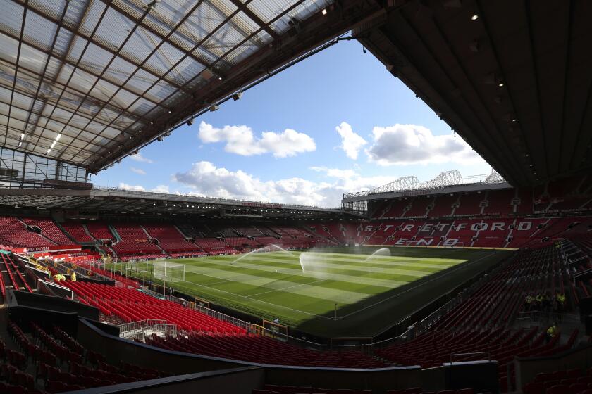 FILE - A general view of the Manchester United's stadium Old Trafford, in Manchester, England, Aug. 10, 2018. A soccer fan has been arrested and charged for alleged tragedy chanting during Manchester United's game against Burnley, Police said Sunday. (AP Photo/Jon Super, File)