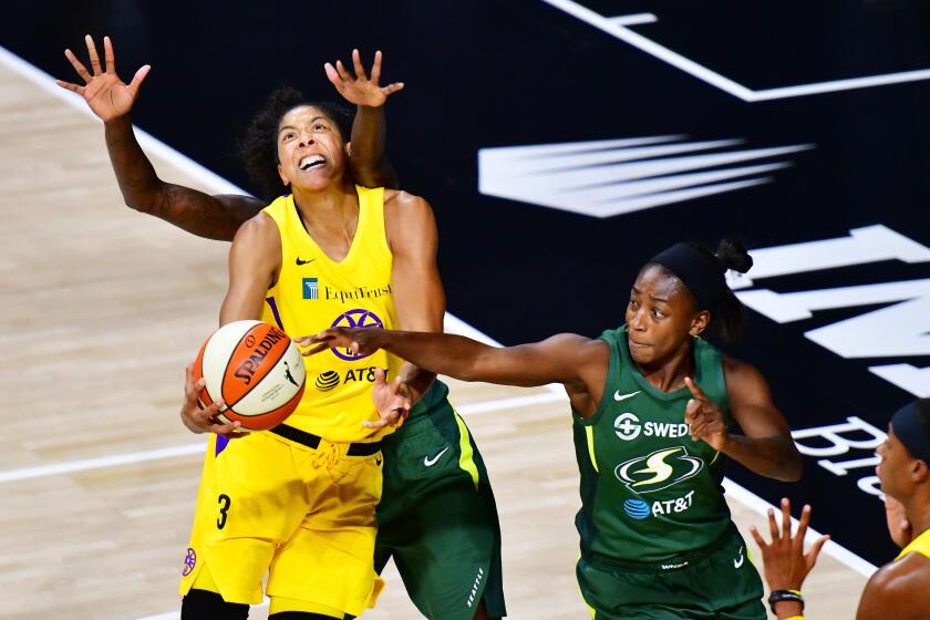PALMETTO, FLORIDA - SEPTEMBER 04: Candace Parker #3 of the Los Angeles Sparks draws the foul from Natasha Howard #6 of the Seattle Storm during the first half of a game at Feld Entertainment Center on September 04, 2020 in Palmetto, Florida. NOTE TO USER: User expressly acknowledges and agrees that, by downloading and or using this photograph, User is consenting to the terms and conditions of the Getty Images License Agreement. (Photo by Julio Aguilar/Getty Images)