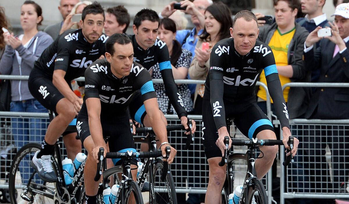 Tour de France defending champion Chris Froome, right, and his teammates ride in Leeds, England, during a prerace ceremony on Thursday.