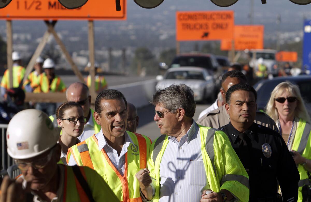 Los Angeles County supervisor Zev Yaroslavsky, with then-Los Angeles Mayor Antonio Villaraigosa, at the site of the Mulholland Bridge demolition in 2012. The Metro board voted Thursday to change the name of the Red Line terminus to North Hollywood/Zev Yaroslavsky station in his honor.