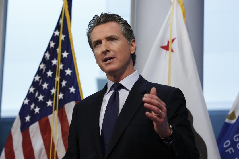 Gov. Gavin Newsom updates the state's response to the coronavirus, at the Governor's Office of Emergency Services in Rancho Cordova, Calif., Monday, March 30, 2020. Newsom announced the state is enlisting retired doctors and medical and nursing students to help treat an anticipated surge of coronavirus patients. (AP Photo/Rich Pedroncelli, POOL)