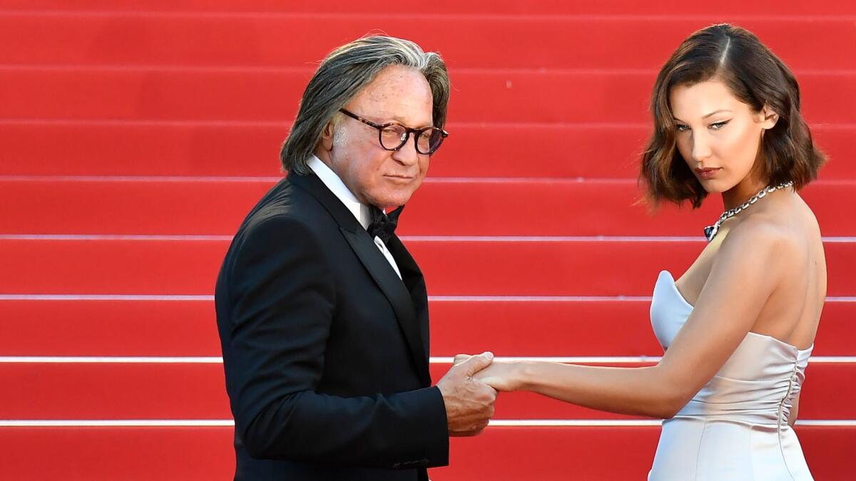 Mohamed Hadid and his daughter, model Bella Hadid, arrive for the screening of the film "Ismael's Ghosts" at the Cannes Film Festival in southern France this month.