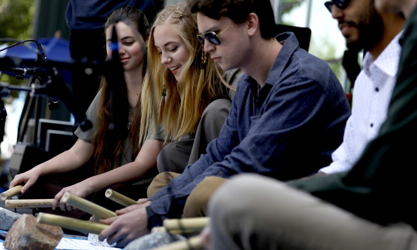 Cal State Northridge students offer a musical performance using instruments made from Arundo donax, an invasive species that can look like bamboo and that can impede the flow of water in the L.A. River.