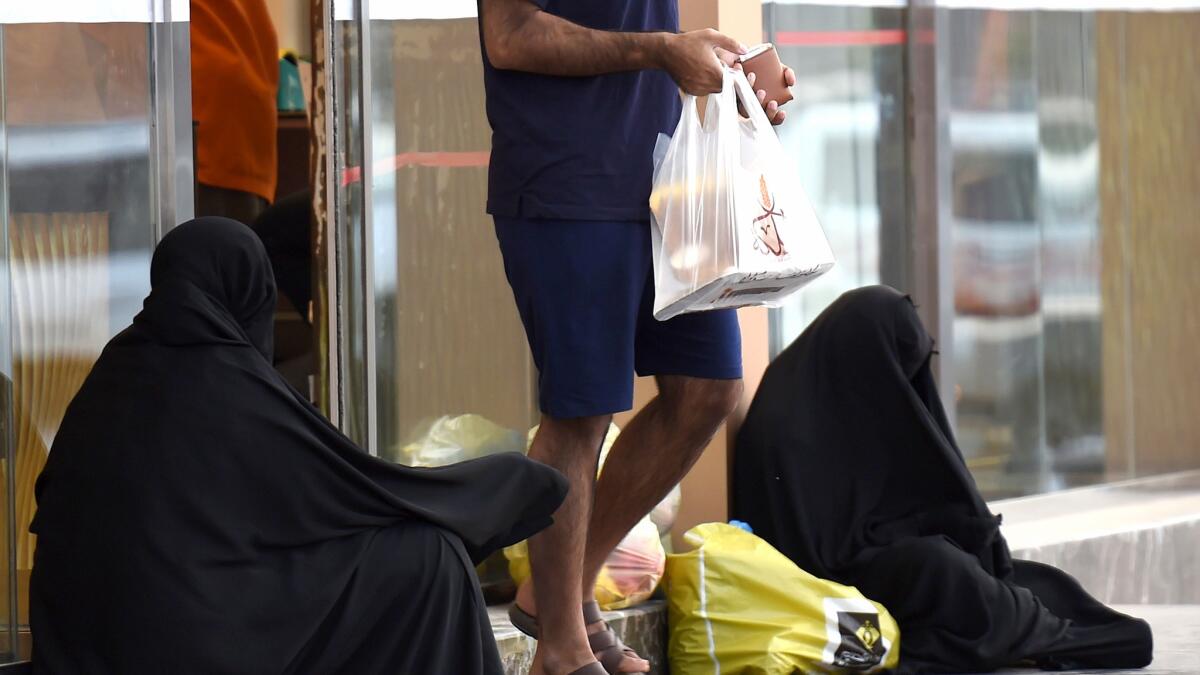 Women beg outside a supermarket on a main street in the Saudi capital Riyadh, on June 20, 2016. (Fayez Nureldine / AFP / Getty Images)