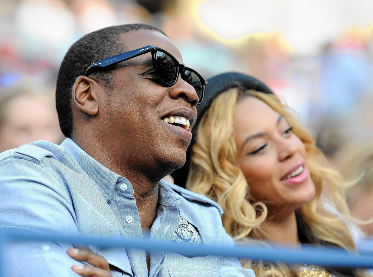 A video containing footage of Jay-Z used to support Proposition 47 is the subject of a campaign penalty. The entertainment mogul is seen here with his wife, Beyoncé.