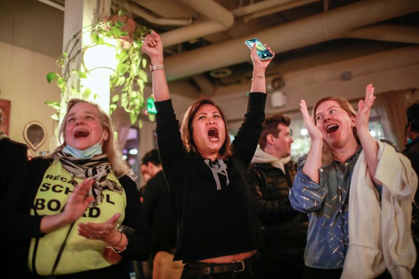 Women cheer as they celebrate at the pro-recall party at Manny's restaurant on Tuesday, Feb. 15, 2022