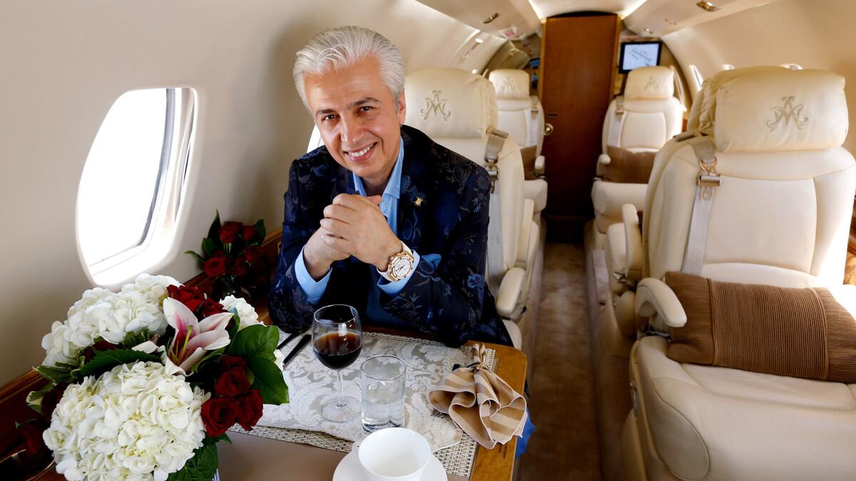 Michael Amini, furniture designer, on his private jet.