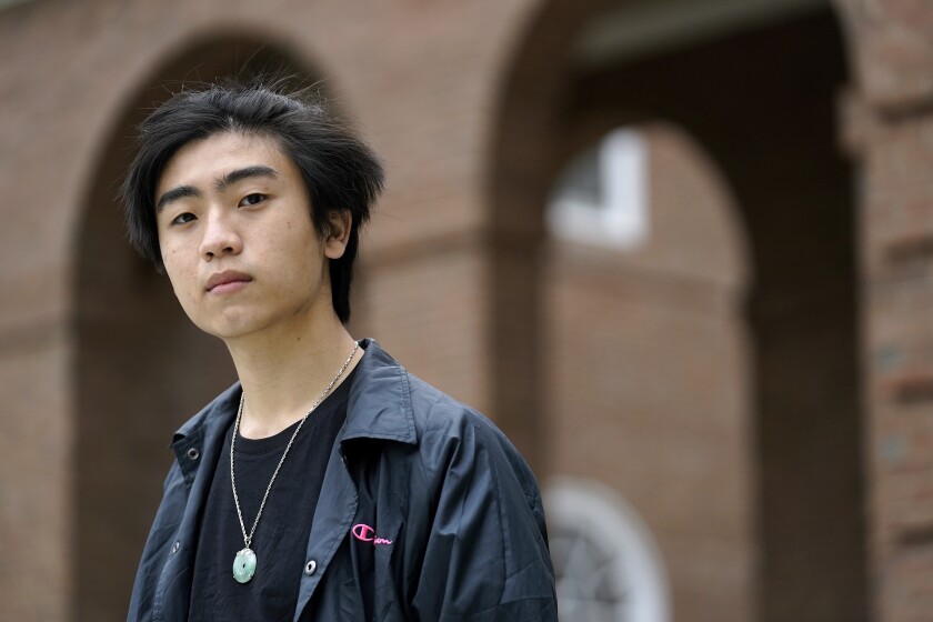 Nicholas Sugiarto, of San Diego, Calif., a student at Dartmouth College, stands for a photograph on the school's campus, Tuesday, April 20, 2021, in Hanover, N.H. A wave of anti-Asian attacks that started more than a year ago with the pandemic, along with the March 2021 shootings in Atlanta that left six Asian women dead, have provoked national conversations about the visibility of Asian Americans. (AP Photo/Steven Senne)