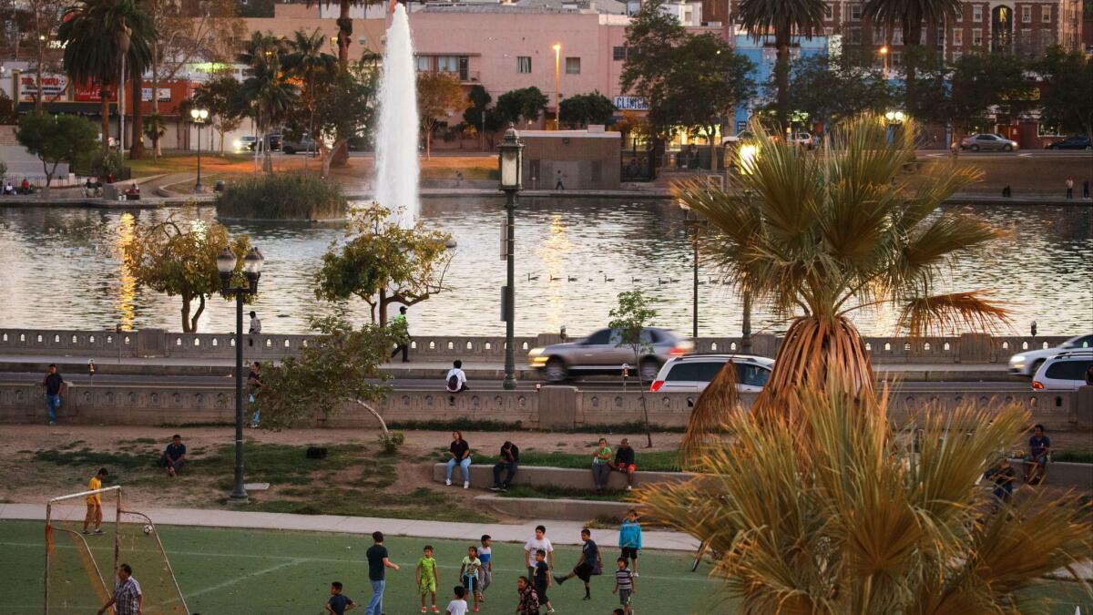 Children play soccer on the fields at the north side of MacArthur Park on Thursday, October 6, 2016 in the Westlake neighborhood of Los Angeles. Police said a body was found in the lake Wednesday morning.