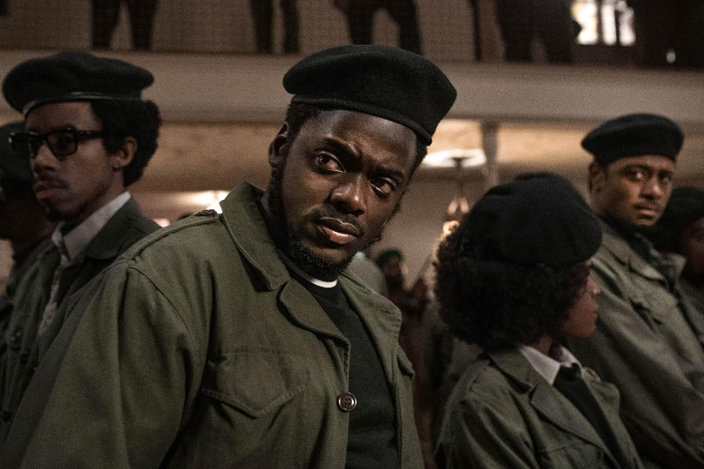 A group of actors in Black Panther uniforms in "Judas and the Black Messiah"