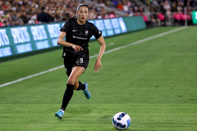LOS ANGELES, CALIFORNIA - JUNE 07: Christen Press #23 of Angel City FC chases after a ball.
