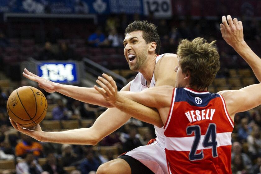 Andrea Bargnani, left, drives past Jan Vesely of the Washington Wizards during a game in October 2012. The Toronto Raptors reportedly have agreed to trade Bargnani to the New York Knicks.