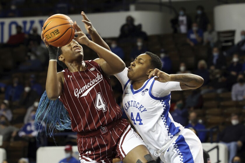 South Carolina's Aliyah Boston (4) shoots while pressured by Kentucky's Dre'Una Edwards (44) during an NCAA college basketball game in Lexington, Ky., Thursday, Feb. 10, 2022. (AP Photo/James Crisp)