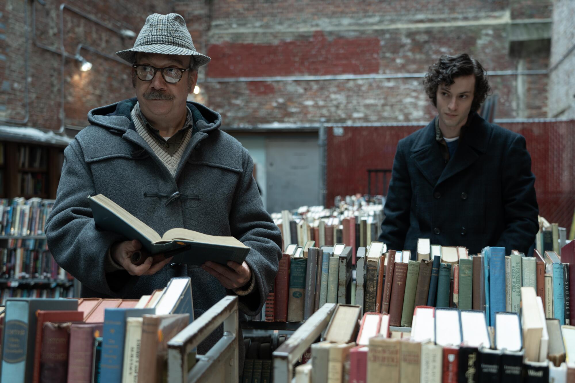 Two men browse in a bookstore.