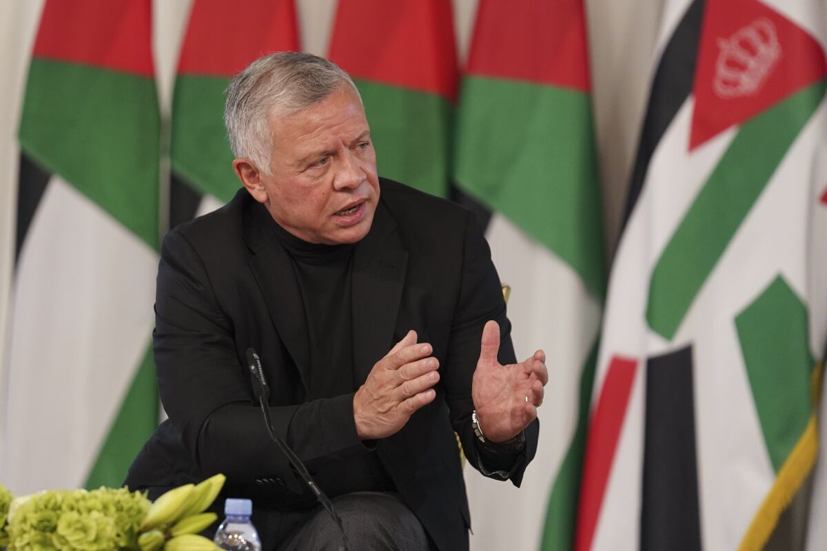 Jordan's King Abdullah II speaks during a meeting with tribal leader in Al-Qasta, south of Amman, Jordan, Monday, Oct. 4, 2021. King Abdullah II denied Monday any impropriety in his purchase of luxury homes abroad, an effort to contain a budding scandal over reports of lavish spending at a time when he has sought international aid to pull his impoverished country out of recession and help it cope with soaring unemployment. (Yousef Allan/The Royal Hashemite Court via AP)