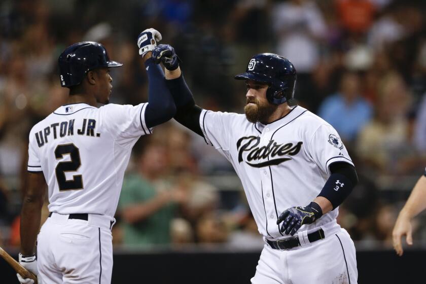 San Diego catcher Derek Norris is greeted by outfielder Melvin Upton Jr. (2) after hitting a three-run home run against San Francisco during the second inning of a game Thursday.