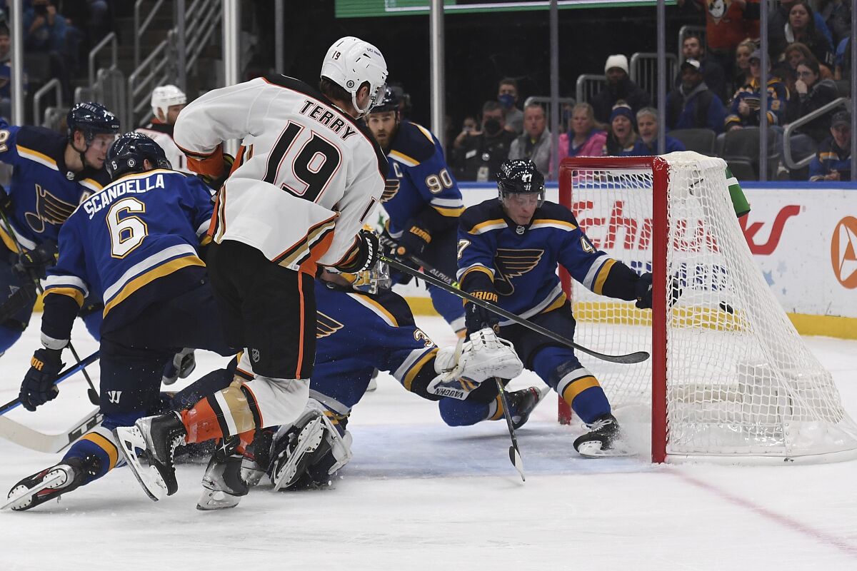 Anaheim Ducks' Troy Terry (19) scores a goal during the third period of an NHL hockey game against the St. Louis Blues Sunday, Dec.12, 2021, in St. Louis. (AP Photo/Michael Thomas)